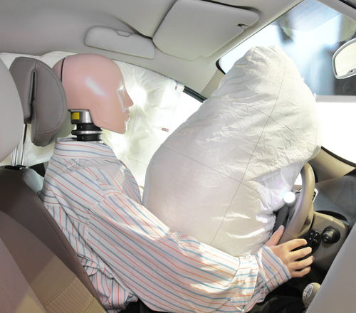 Picture of deployed airbag and stunt dummy