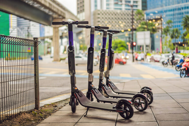 Electric scooters lined up on street